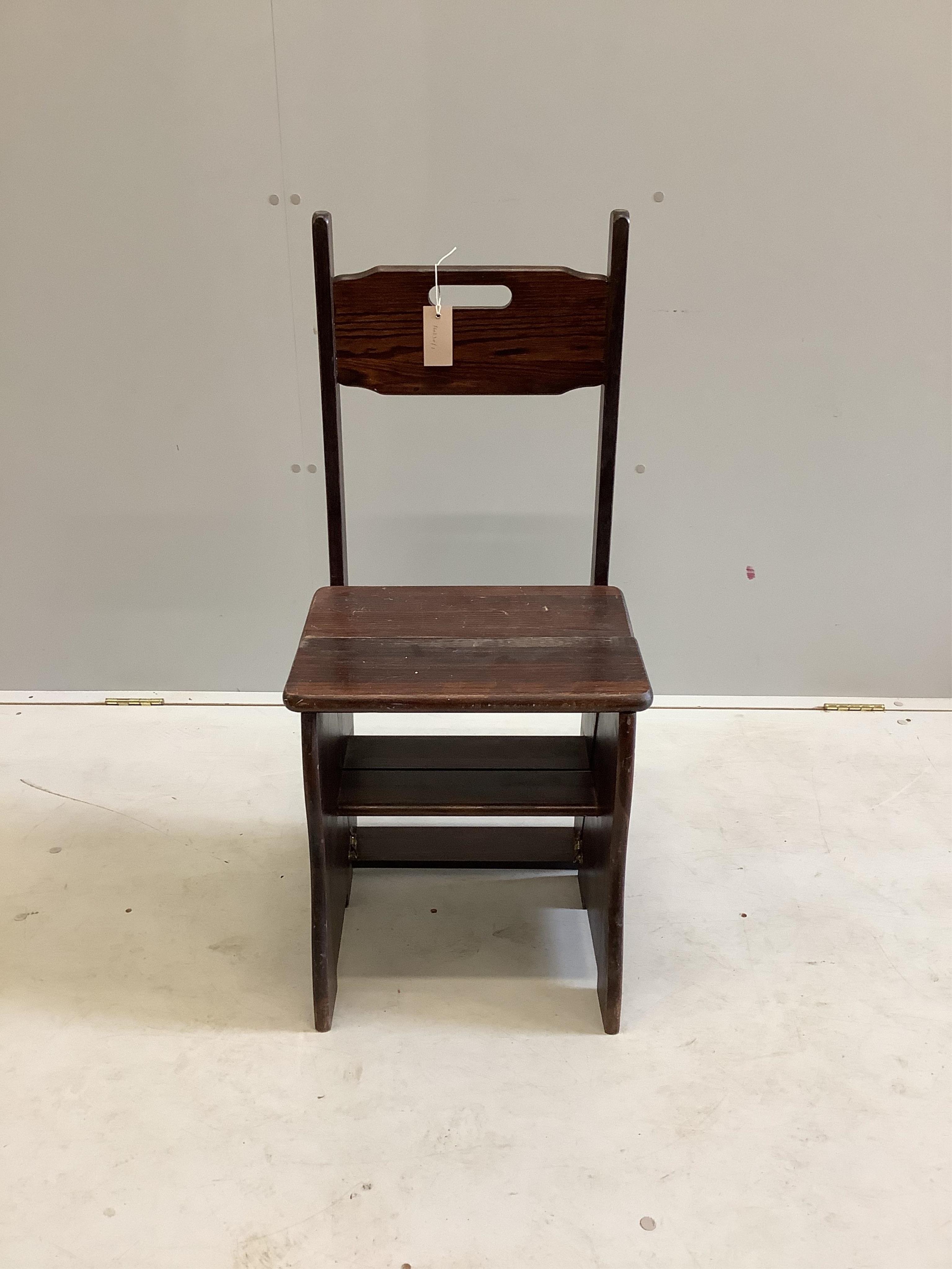 A stained pine metamorphic library chair, width 41cm, depth 36cm, height 92cm. Condition - fair